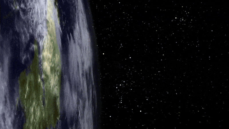 A view from space showing the edge of Earth on the left, highlighted by sunlight, as NASA’s Aeronomy of Ice in the Mesosphere (AIM) spacecraft flies through the frame, shining in the sunlight. The camera pans and follows the spacecraft as it passes through its view. The planet's surface displays a mix of green, brown, and white colors. The right side of the image is filled with a dark, starry expanse.